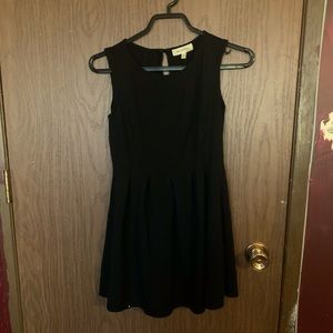 Small, soft black dress. Great for outgoing and dinners. Very classy.
